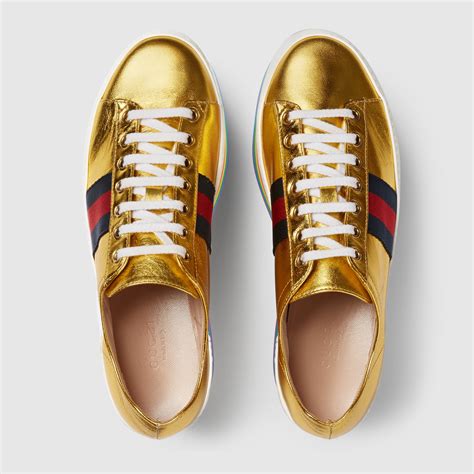 gold Gucci sneakers